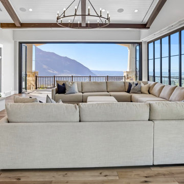 Folding Glass Doors Open the Living Room to the Mountain View Beyond the Deck