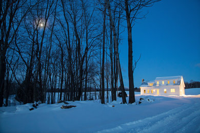 Example of a country exterior home design in Burlington