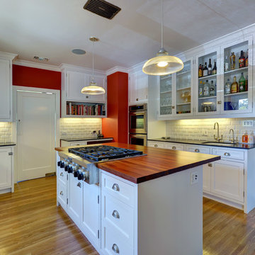 Delightful Contemporary Kitchen with Wood Island Top by DeVos Woodworking