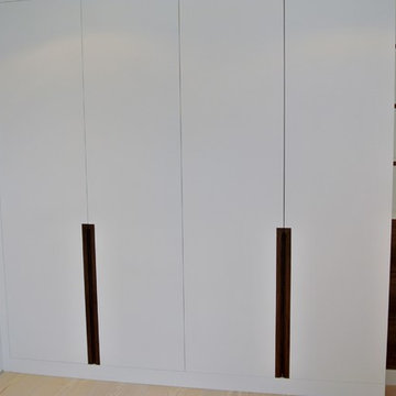 Bespoke Built Master Bedroom Wardrobe 20% Spray Finish with accent Walnut Veneer