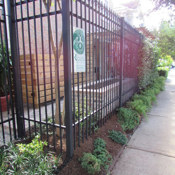 High function in a small side yard! Pergola, raised bed, mirrored wall, fountain