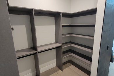 Example of a trendy closet design in Phoenix