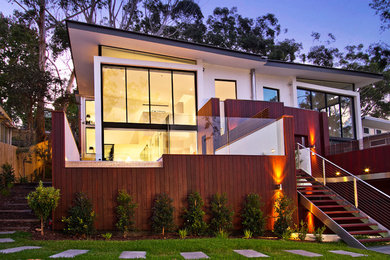 Large contemporary two-storey white exterior in Sydney.