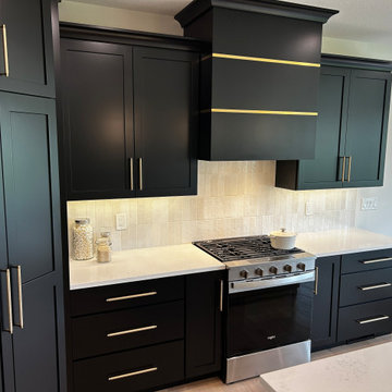Black and Maple Wheat Kitchen with Brass Banded Hood