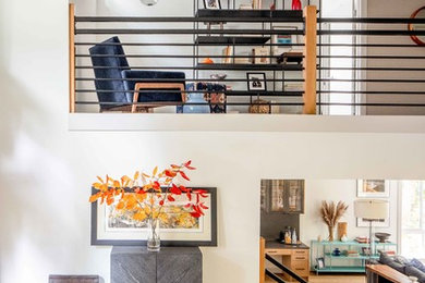 Example of a minimalist light wood floor foyer design in Seattle