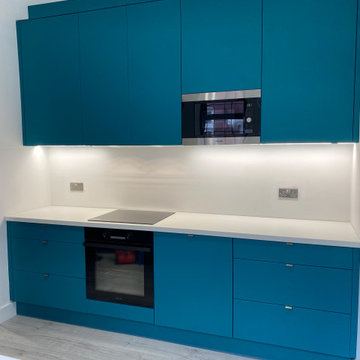 Teal & White Bespoke Kitchen with Feature Wall – London E6