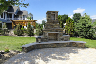 Inspiration for a large partial sun backyard brick landscaping in Minneapolis with a fire pit for summer.