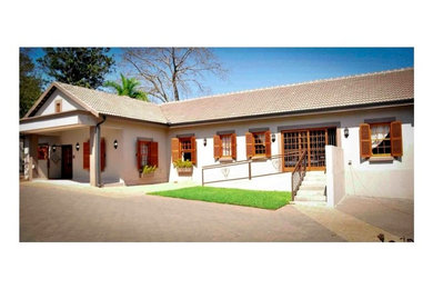 Example of an eclectic exterior home design in Other