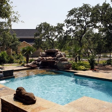 Geometric pool spa with waterfall and Sun shelf