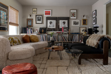 Living room - large eclectic open concept slate floor and black floor living room idea in Austin with a music area, white walls, no fireplace and no tv
