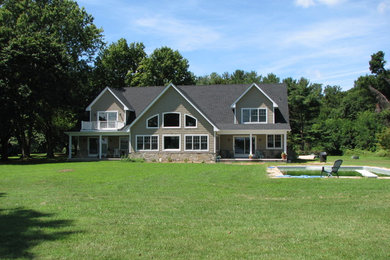 Large traditional brown two-story wood exterior home idea in Baltimore with a shingle roof