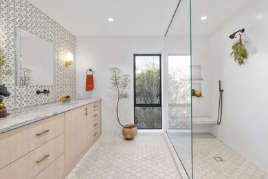 Inspiration for a southwestern master terra-cotta tile, white floor and double-sink shower bench remodel in Phoenix with flat-panel cabinets, light wood cabinets, white walls, quartzite countertops and a built-in vanity