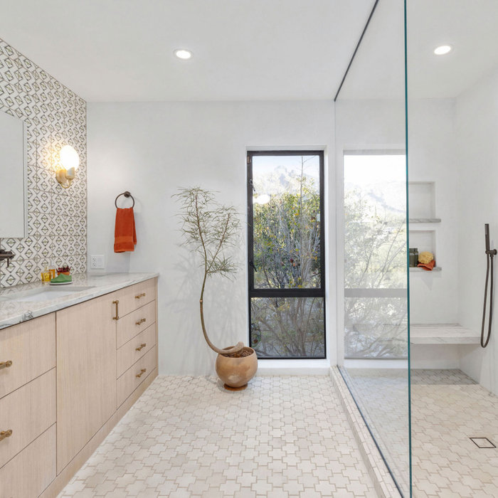 Inspiration for a southwestern master terra-cotta tile, white floor and double-sink shower bench remodel in Phoenix with flat-panel cabinets, light wood cabinets, white walls, quartzite countertops an