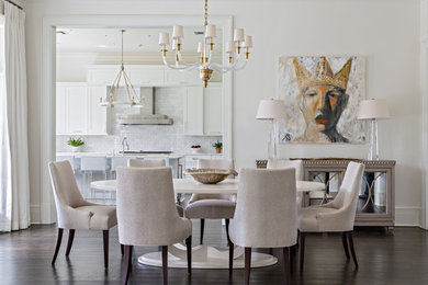 Mid-sized transitional dining room in New Orleans with white walls and dark hardwood floors.