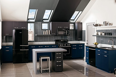 Design ideas for a large contemporary l-shaped separate kitchen in New York with an undermount sink, flat-panel cabinets, blue cabinets, granite benchtops, black splashback, porcelain splashback, black appliances, porcelain floors and with island.