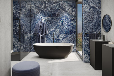 Design ideas for a large contemporary master bathroom in Melbourne with black cabinets, a freestanding tub, an open shower, a one-piece toilet, blue tile, ceramic tile, blue walls, concrete floors, a pedestal sink, solid surface benchtops, grey floor, an open shower, white benchtops, a double vanity and a freestanding vanity.