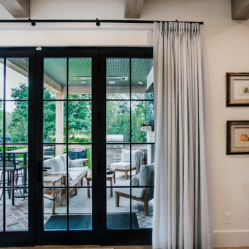 Functional drapes with 2-Finger Pinch Pleat on a Matte Black Traverse Rod