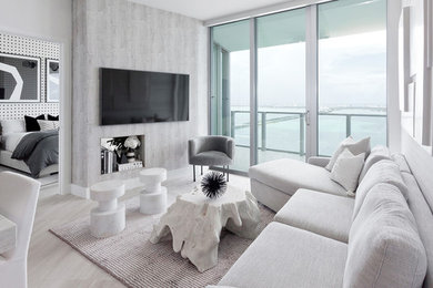 Living room - contemporary white floor living room idea in Miami with gray walls and a wall-mounted tv
