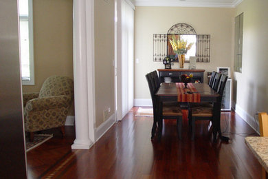 Inspiration for a mid-sized dark wood floor kitchen/dining room combo remodel in Chicago with beige walls and no fireplace