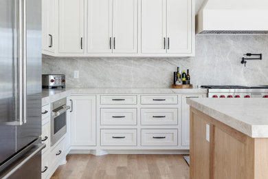 Large transitional light wood floor kitchen photo in Dallas with a farmhouse sink and an island