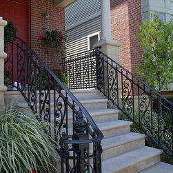 Solid stone stairs with ornamental iron railing - Products