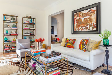 Family room library - mid-sized eclectic enclosed terra-cotta tile family room library idea in Miami with beige walls, no fireplace and a wall-mounted tv