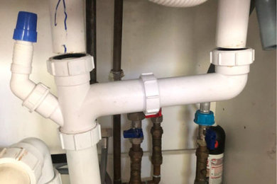 Plumbing service in London - repairing leak from burst pipe