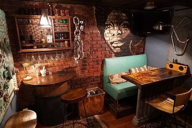 Inspiration for a mid-sized eclectic single-wall dark wood floor and brown floor seated home bar remodel in New York with no sink, open cabinets, dark wood cabinets, wood countertops, brick backsplash and brown countertops