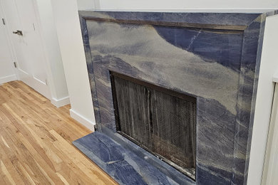 Fireplace.  Natural Azul Imperial stone front with special cut.