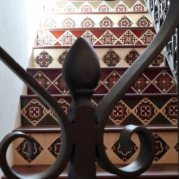 Spanish-tiled staircase leading to bedroom