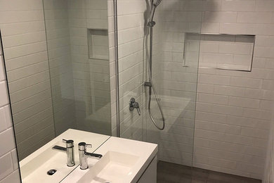 Small 3/4 bathroom in Melbourne with white cabinets, an open shower, a one-piece toilet, white tile, ceramic tile and an open shower.