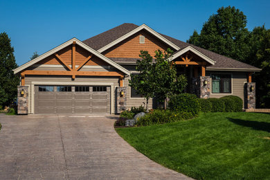 Mid-sized rustic beige one-story exterior home idea in Other
