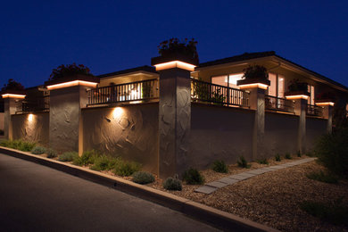 This is an example of a mid-sized contemporary one-storey stucco beige house exterior in San Luis Obispo with a tile roof.