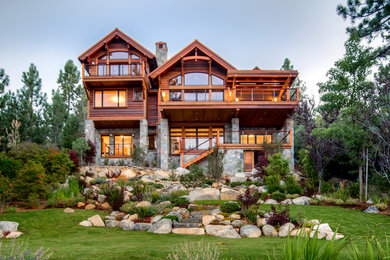 Large mountain style brown three-story mixed siding exterior home photo in Sacramento