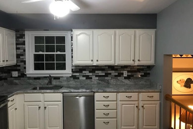 Example of a classic kitchen design in Other