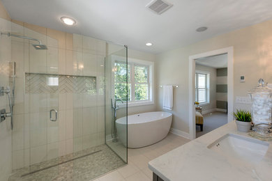 Bathroom - large transitional master beige floor bathroom idea in Minneapolis with recessed-panel cabinets, gray cabinets, beige walls, an undermount sink and a hinged shower door