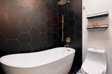 Example of a mid-sized minimalist master black tile ceramic tile and multicolored floor bathroom design in Chicago with a one-piece toilet and multicolored walls