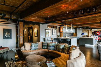 Living room - mid-sized contemporary open concept dark wood floor living room idea in Denver with white walls and a wall-mounted tv
