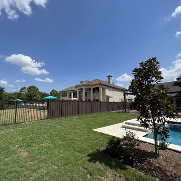 Dark Brown Composite Trex Fence and Black Iron Fence