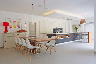 Inspiration for a contemporary kitchen/dining combo in Manchester with white walls.