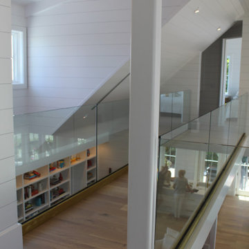 Glass Balustrade with Aluminum Base Rail Finished with Satin Brass Cladding
