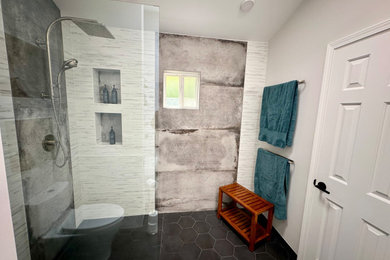 Bathroom - large contemporary black and white tile and porcelain tile porcelain tile, black floor, double-sink and vaulted ceiling bathroom idea in San Francisco with flat-panel cabinets, medium tone wood cabinets, a one-piece toilet, white walls, an integrated sink, quartz countertops, black countertops and a freestanding vanity