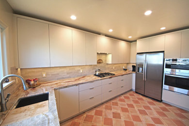 Inspiration for a large galley eat-in kitchen in San Francisco with beige splashback, stainless steel appliances, ceramic floors, no island and multi-coloured floor.