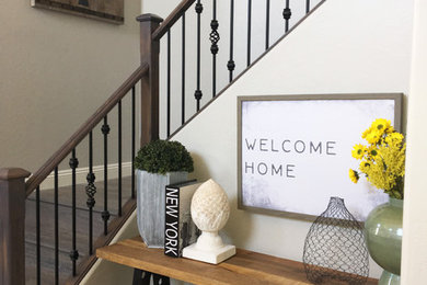 Mid-sized mountain style foyer photo in Phoenix with gray walls