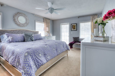 Design ideas for a large contemporary master bedroom in Orlando with grey walls, carpet and no fireplace.
