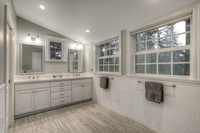 Large elegant master white tile and subway tile marble floor alcove shower photo in Seattle with a one-piece toilet, gray walls, recessed-panel cabinets, white cabinets, an undermount sink and granite countertops