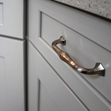 Waypoint Gray Shaker Door Cabinetry with Tiled Shower and Matching Tub Surround