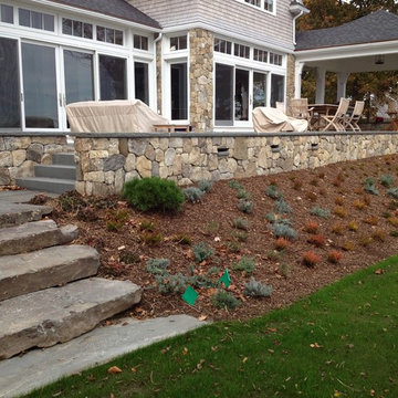 Massive stone steps lead from lawn to bluestone landing