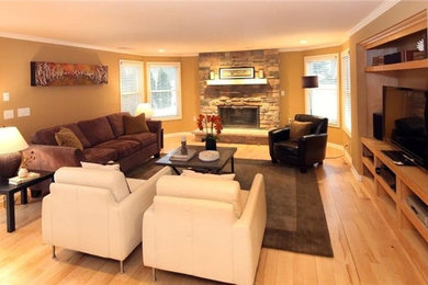 This is an example of a transitional family room in Milwaukee.