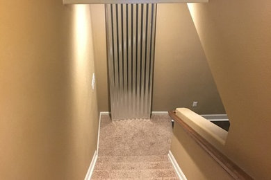 Example of a small minimalist underground medium tone wood floor basement design in Denver